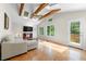 Bright living area with vaulted ceilings, wood beams, and backyard access at 3325 N Embry Cir, Atlanta, GA 30341