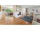 Inviting living room featuring hardwood floors, a fireplace, and seamless flow to the dining area at 3325 N Embry Cir, Atlanta, GA 30341