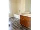 This bathroom has a wood vanity and a shower and tub combo at 3604 Hopkins Ct, Powder Springs, GA 30127