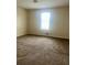 Bright bedroom with tan carpet and a window that allows for great natural light at 3604 Hopkins Ct, Powder Springs, GA 30127