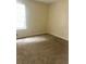 Bedroom with neutral carpet and a sunlit window, offering a calming space at 3604 Hopkins Ct, Powder Springs, GA 30127
