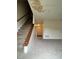 Interior shot of the home's living room with stairs, carpet flooring, and signs of water damage at 3604 Hopkins Ct, Powder Springs, GA 30127