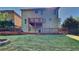 Backyard featuring multiple decks, large grassy area, and back of house at 609 Millstone Dr, Jonesboro, GA 30238