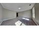 Large bedroom featuring neutral carpet and walls with a single window at 609 Millstone Dr, Jonesboro, GA 30238