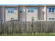 View of backyard with wood fence at 6415 Shalks Crossing Dr, Lithonia, GA 30058