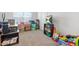 Unfinished basement area with carpet flooring and entertainment options at 6415 Shalks Crossing Dr, Lithonia, GA 30058