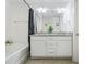 Bright bathroom with a shower-tub combo and a double sink vanity, perfect for a relaxing experience at 6415 Shalks Crossing Dr, Lithonia, GA 30058