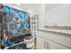 Bathroom with stylish shower curtain, granite countertop, and black storage shelf at 6415 Shalks Crossing Dr, Lithonia, GA 30058