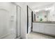Bright bathroom with a glass shower and a double sink vanity, creating a spa-like retreat at 6415 Shalks Crossing Dr, Lithonia, GA 30058