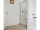 Bathroom features walk-in shower, tiled flooring and bright light at 6415 Shalks Crossing Dr, Lithonia, GA 30058