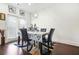 Bright dining room with stylish lighting and a door to the outside, perfect for entertaining at 6415 Shalks Crossing Dr, Lithonia, GA 30058