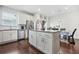 Stylish kitchen with stainless steel appliances, island, and hardwood floors at 6415 Shalks Crossing Dr, Lithonia, GA 30058
