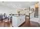Open concept kitchen with center island, stainless appliances, and hardwood floors at 6415 Shalks Crossing Dr, Lithonia, GA 30058