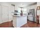 Modern kitchen with stainless steel appliances, island, and ample cabinet space at 6415 Shalks Crossing Dr, Lithonia, GA 30058