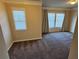Bedroom with neutral carpet, crown moulding, and lots of natural light at 3084 Turman Cir, Decatur, GA 30033