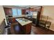 Open kitchen with granite island, stainless steel appliances, and dark wood cabinetry at 3084 Turman Cir, Decatur, GA 30033