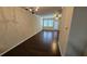 Bright living room with hardwood floors, large windows, and a ceiling fan at 3084 Turman Cir, Decatur, GA 30033