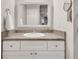 Clean bathroom vanity with bright mirror and decorative lighting at 3085 Colonial Way # L, Atlanta, GA 30341