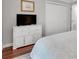 Bedroom with a dresser, TV and closet with a comfortable looking bed at 3085 Colonial Way # L, Atlanta, GA 30341