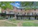 Townhome exteriors with balconies, patios, and landscaping at 3085 Colonial Way # L, Atlanta, GA 30341