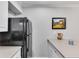 Clean kitchen with ample counter space, a black refrigerator, and bright decor at 3085 Colonial Way # L, Atlanta, GA 30341