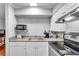 Efficient kitchen featuring stainless steel appliances and bright white cabinetry at 3085 Colonial Way # L, Atlanta, GA 30341
