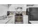 Modern kitchen featuring stainless steel appliances, and white cabinets for a clean look at 3085 Colonial Way # L, Atlanta, GA 30341