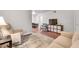 Comfortable living room boasts a TV and seamless flow to a dining area, perfect for modern living at 3085 Colonial Way # L, Atlanta, GA 30341