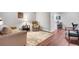 Bright living room featuring a cozy seating arrangement, hardwood floors, and modern decor at 3085 Colonial Way # L, Atlanta, GA 30341