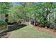 Backyard with a play area and storage shed, perfect for Gathering fun and outdoor activities at 320 Hillside Manor Dr, Sugar Hill, GA 30518