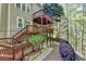 Lovely backyard featuring a multi-level deck, landscaping, and mature trees offering a private outdoor oasis at 320 Hillside Manor Dr, Sugar Hill, GA 30518