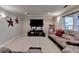 Finished basement with plush carpeting, recessed lights, and large sectional sofa at 320 Hillside Manor Dr, Sugar Hill, GA 30518