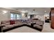 Finished basement featuring a large sectional sofa, wet bar, and entertainment area at 320 Hillside Manor Dr, Sugar Hill, GA 30518