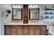 Bathroom with dual sinks, granite countertops, and wood cabinetry at 320 Hillside Manor Dr, Sugar Hill, GA 30518