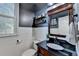 Stylish bathroom features shiplap wall, decorative shelves, and a dark granite countertop at 320 Hillside Manor Dr, Sugar Hill, GA 30518