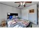 Comfortable bedroom featuring a ceiling fan, closet, and a well-lit interior at 320 Hillside Manor Dr, Sugar Hill, GA 30518