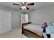 Cozy bedroom with a ceiling fan, carpet, and a small bed at 320 Hillside Manor Dr, Sugar Hill, GA 30518