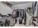 Walk-in closet featuring multiple storage shelves and hanging rods at 320 Hillside Manor Dr, Sugar Hill, GA 30518