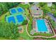 Overhead view showcases community amenities including tennis courts, pool, clubhouse, and playground at 320 Hillside Manor Dr, Sugar Hill, GA 30518