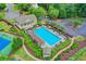 Aerial shot of a community pool, lounge chairs, shade structures, and meticulously landscaped grounds at 320 Hillside Manor Dr, Sugar Hill, GA 30518