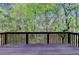Enjoy the beautiful wooded scenery from this expansive deck, creating a private and tranquil retreat at 320 Hillside Manor Dr, Sugar Hill, GA 30518