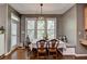 Charming breakfast nook with built-in seating and windows offering pleasant natural light and wooded views at 320 Hillside Manor Dr, Sugar Hill, GA 30518
