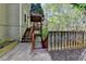 Exterior of the home featuring a multi-tiered deck and walkout basement at 320 Hillside Manor Dr, Sugar Hill, GA 30518