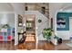 Bright foyer with hardwood floors, staircase, and arched entryways, offering a welcoming entrance at 320 Hillside Manor Dr, Sugar Hill, GA 30518