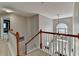 Spacious foyer with a grand staircase and a large window providing ample natural light at 320 Hillside Manor Dr, Sugar Hill, GA 30518