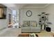 Comfortable living room with neutral tones, fireplace, and a cozy cat tree at 320 Hillside Manor Dr, Sugar Hill, GA 30518