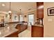Finished basement wet bar featuring a granite counter, sink, and custom wood cabinets for storage and entertaining at 320 Hillside Manor Dr, Sugar Hill, GA 30518