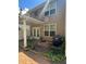 Backyard patio view of exterior showing windows and siding at 4036 Carlinswood Way, Stone Mountain, GA 30083