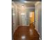 Spacious entryway featuring hardwood floors and a view of a powder room at 4036 Carlinswood Way, Stone Mountain, GA 30083