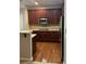 Well-appointed kitchen with stainless steel appliances, wood cabinets, and hardwood floors at 4036 Carlinswood Way, Stone Mountain, GA 30083